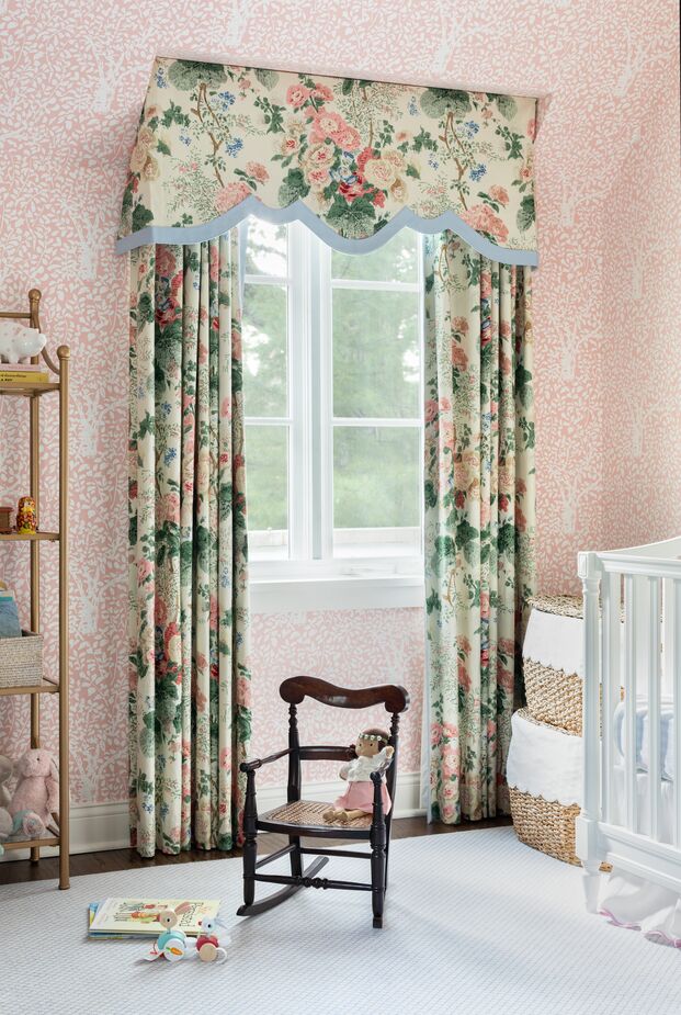 The Althea pattern from Lee Jofa was originally meant for the primary bedroom. Instead Alex used it for the nursery curtains to complement the Arbre de Matisse wallpaper from China Seas. “I had actually pushed for a bit more of a funky patterned grass cloth in here, but my sister wanted this floral-on-floral feel, and I’m so glad she pushed me,” Alex says. Find a similar étagère here.
