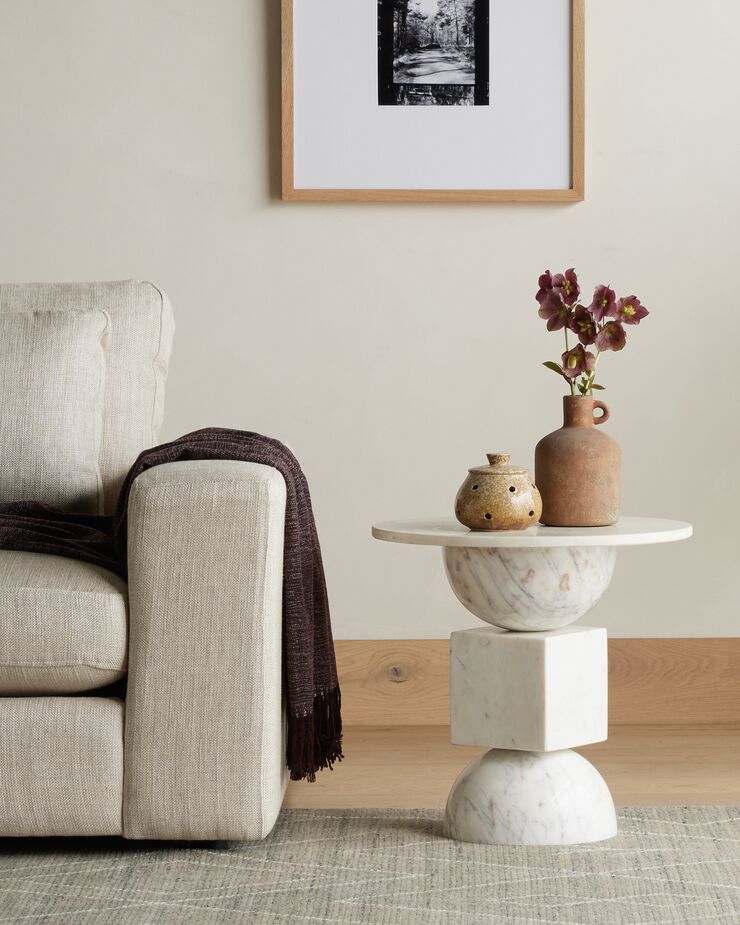 The Nido Marble End Table leans into the stone’s sculptural elegance. Find a similar sofa here.
