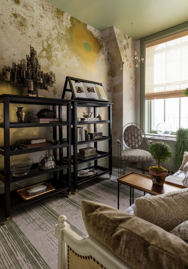 Clinton Smith Studio dubbed this bijou room “The Hideaway,” and it is ideal for escaping to savor some me time. The golden celestial wallpaper encourages daydreaming, while the daybed encourages napping. 
