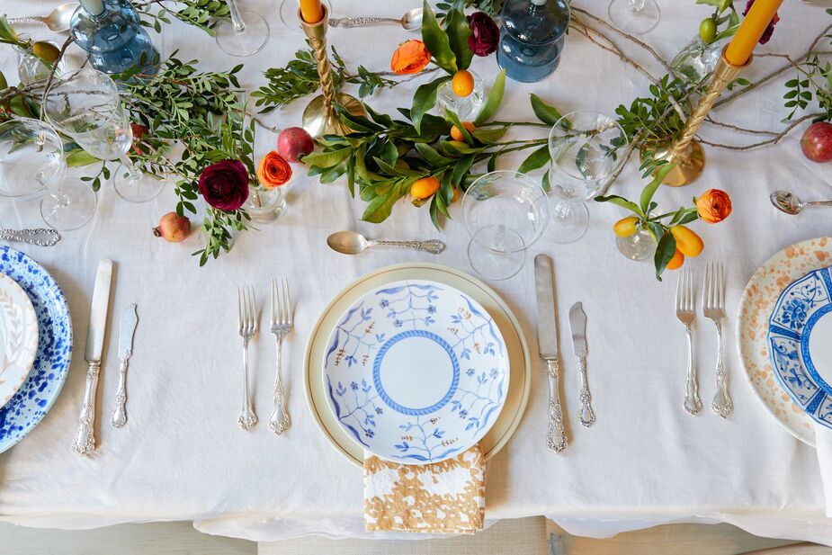 Mixing rather than matching china patterns makes this table setting one of a kind. Keeping to a tight palette ensures that the effect is a sophisticated one.
