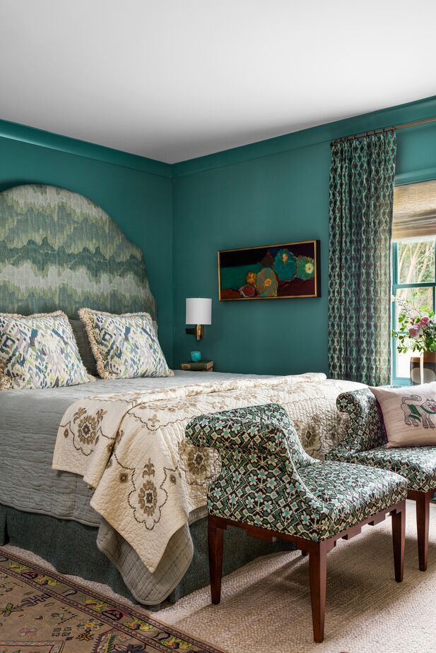 The primary bedroom features fewer colors than other rooms, but not fewer patterns.
