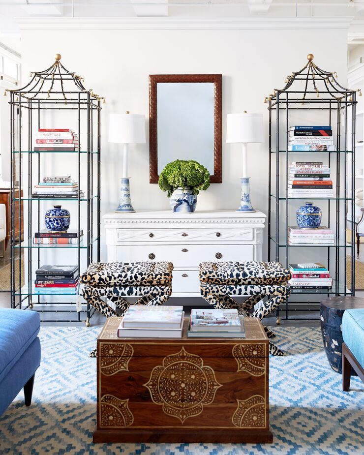 A pair of Dalton Pillow-Top Ottomans in Leopard bring another layer of luxuriousness to this lavish curated room.
 
