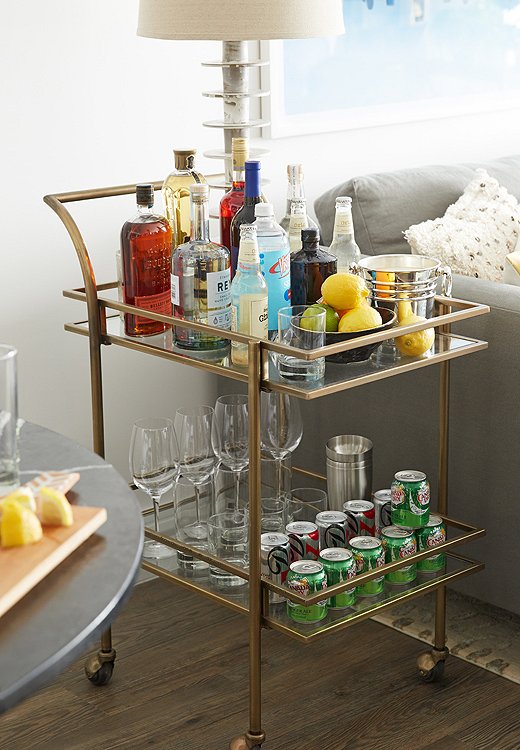 A bar cart is especially useful for smaller homes: Post-party, you can use it to display favorite items or to hold anything from books to tablets. Photo by Tony Vu. 
