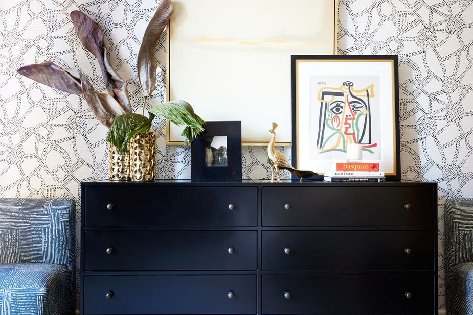 The handsome Philipe 8-Drawer Dresser is constructed of iron and steel to last for generations. The Finn Slipper Chairs in Durban Blue, designed by Nikki for One Kings Lane, on each side of the dresser soften its straight lines. Find Golden View II (hanging on the wall) here; find the Picasso print in front of it here.
