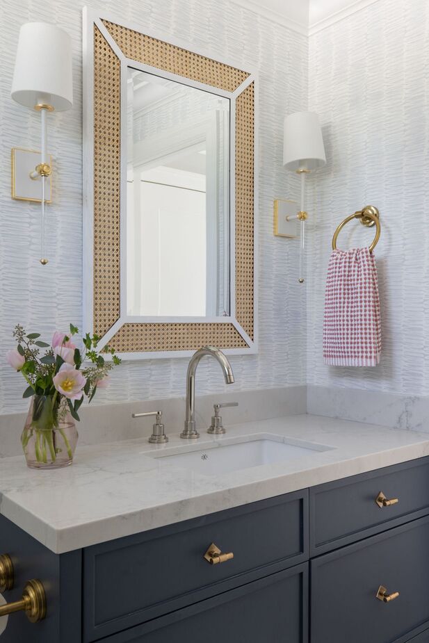 The Sarah Cane Wall Mirror and Lucia Sconces bring touches of Belle Époque Paris to this bathroom.
 
