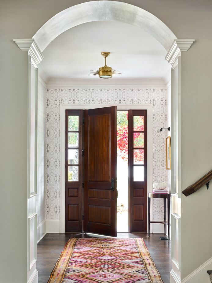 Along with the dining room, the foyer was a favorite space to design. “We wanted it to feel classic but have meaningful and memorable impact as you entered the home,” Lathem says. Find similar vintage floor runners here.
