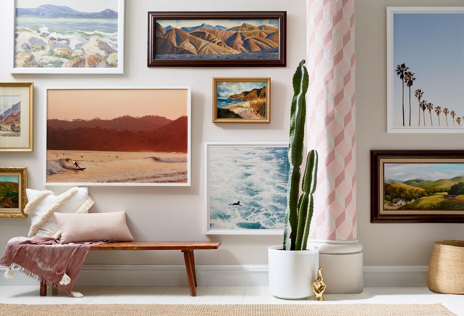 Why settle for one landscape when you can have an entire gallery wall of imagery devoted to a favorite locale—in this case, California. The central sepia-tinged photo is Sunset Surfer by Pascal Shirley; the photo beside it is California Surfer by Christine Flynn. Photo by Tony Vu.
