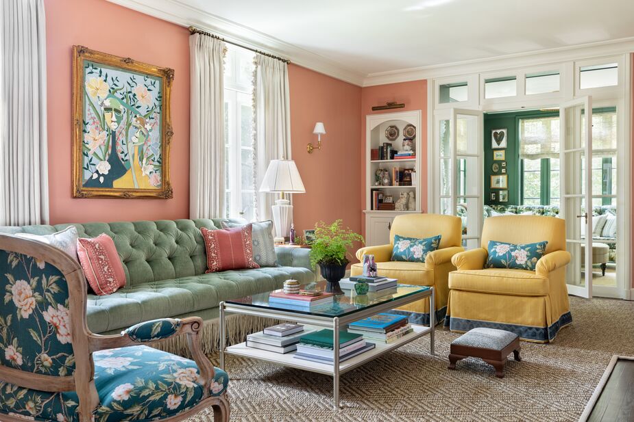 For her sister, “more is more is more, and I love that,” Alex says. In the living room, that means more color. Just about every hue is repeated at least once, though, which creates cohesion. Find a similar rug here. 
