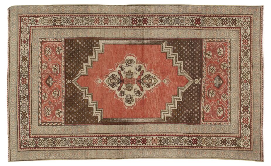 This vintage Oushak rug features a stepped center medallion typical of the most in-demand Oushaks.
