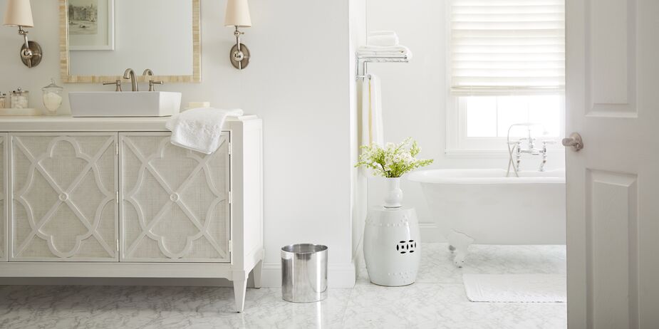 An all-white bathroom is a paragon of luxury, but it’s also easy to refresh with color should you want a change. Swap out your towels, bathmat, and accessories, and voilà! a whole new look. Find the garden stool here. 
