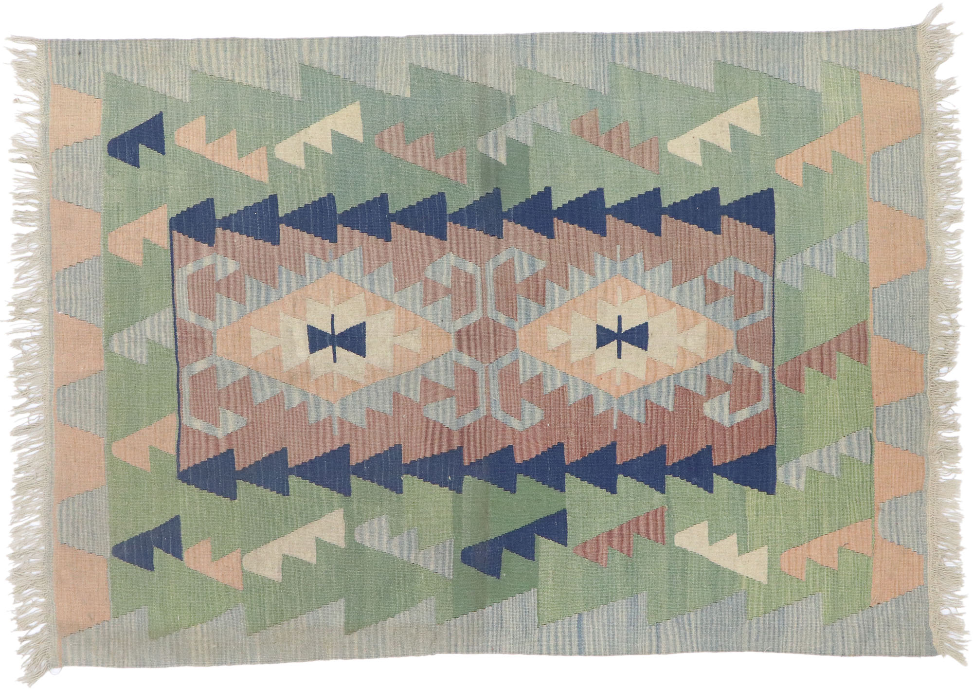 The simpler geometric pattern gives this vintage Shiraz rug a less formal feel than that of other Persian rugs.

