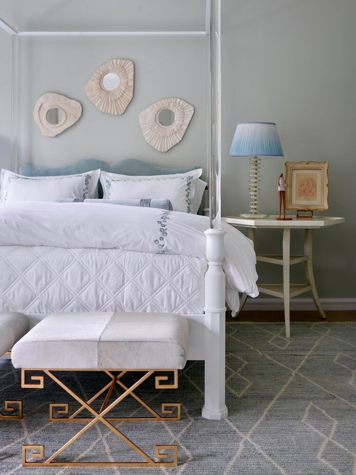 Canopy beds go back centuries, but Woody Yeomans opted for one with Lucite posts to put the “new” into this New Traditional bedroom. Opting for a rug with a large-scale diamond motif rather than a classic Persian or Turkish rug has the same effect. Find bedding with a similar embroidered motif here.

