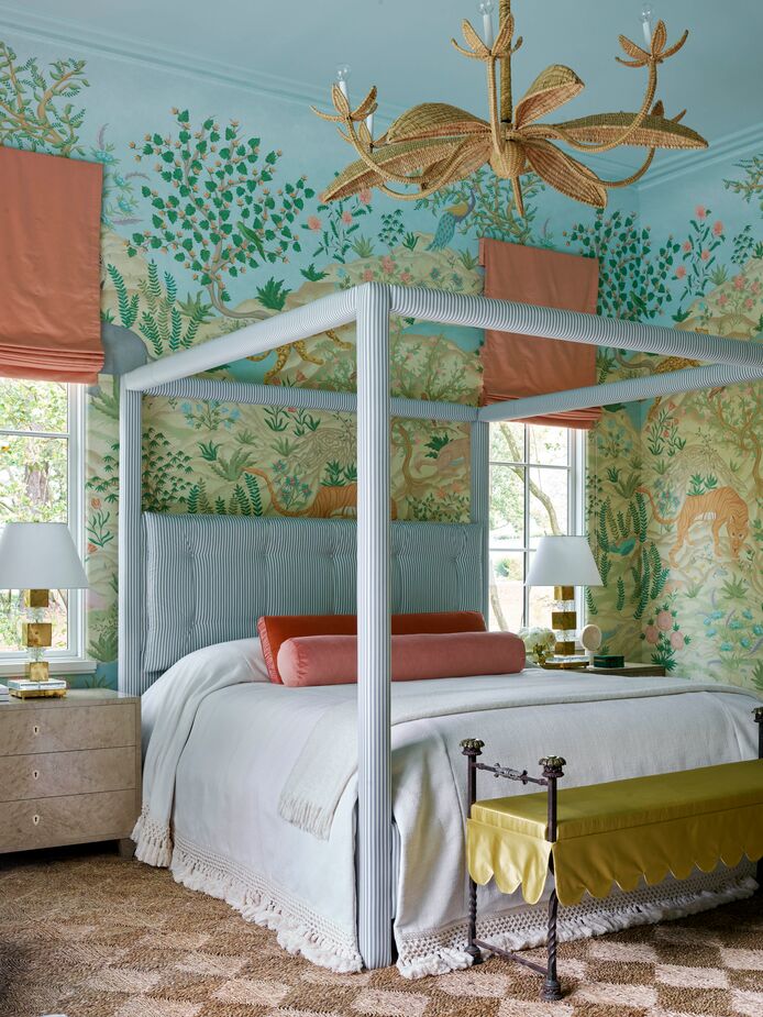 There’s something wild about this bedroom by Melanie Turner, and something quite refined as well. The natural-fiber rug (find a similar one here) and the rattan-wrapped chandelier show how regal earthy materials can be.
