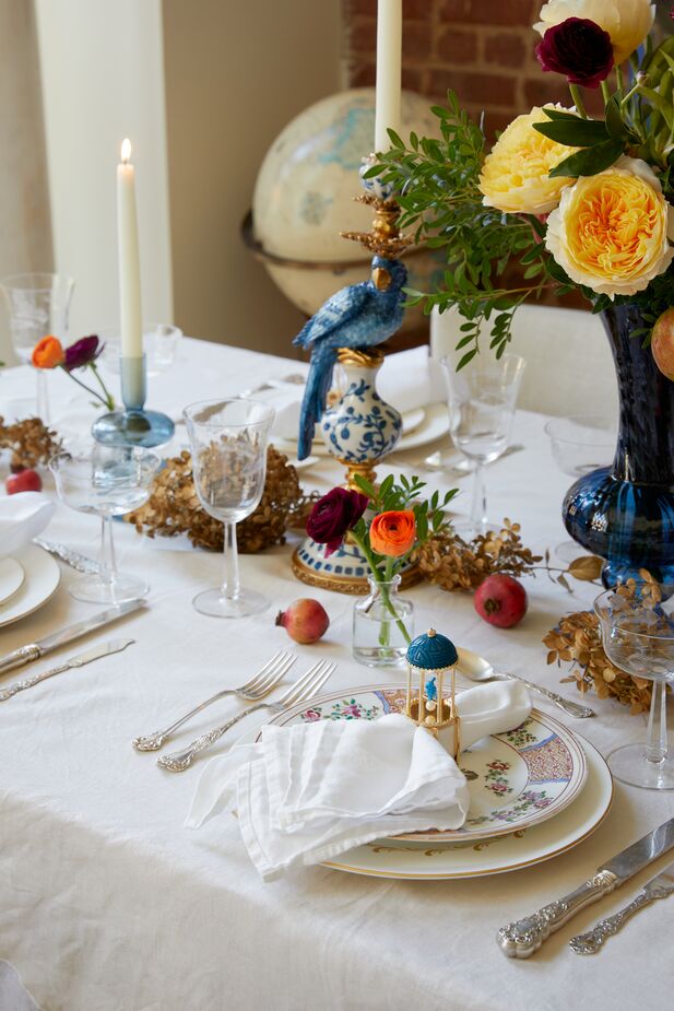 Samantha’s table linens, silverware, and china were passed down to her from her grandmother. She bought the Kim Seybert napkin rings from One Kings Lane when she worked there.
