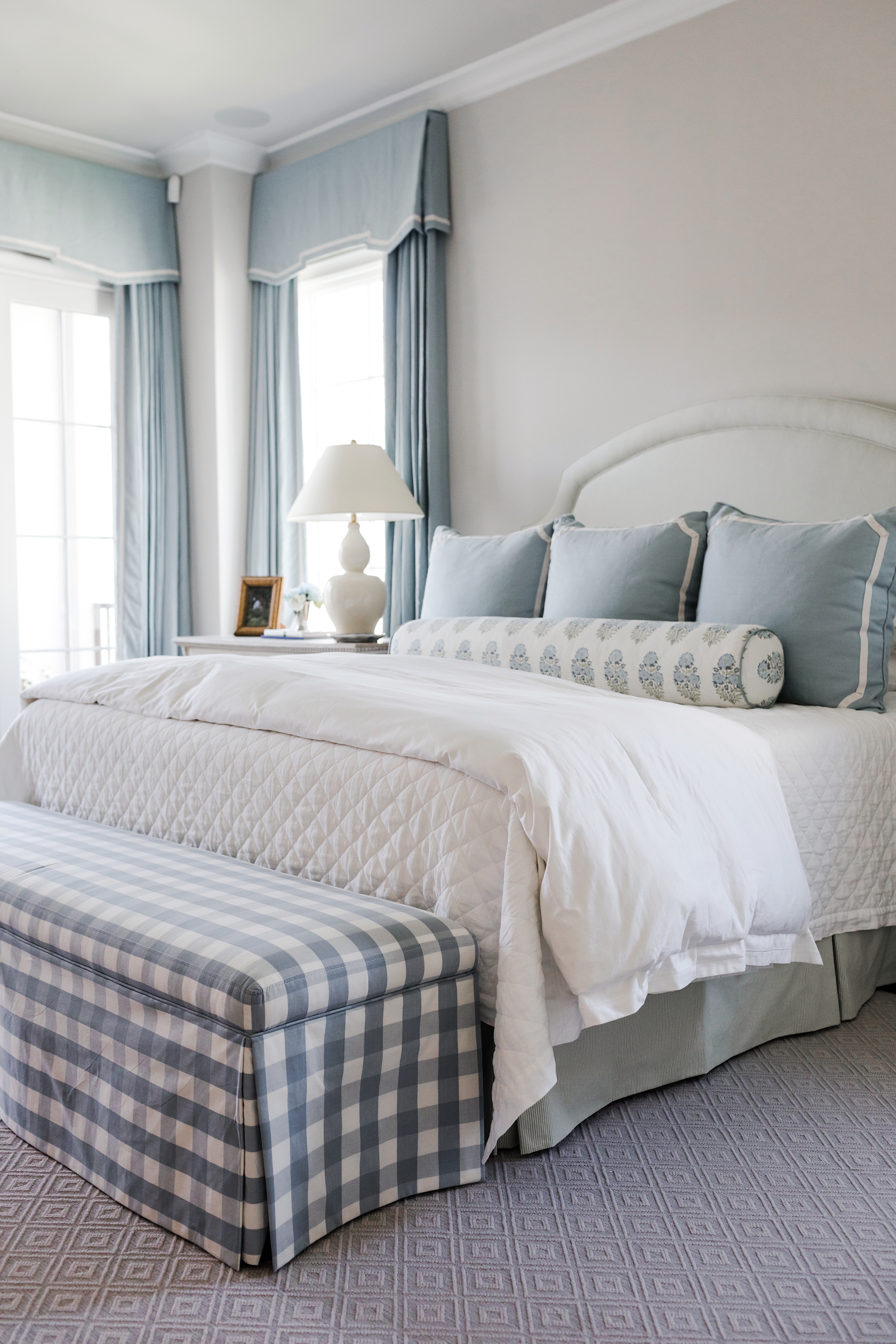 The varied textures and patterns ensure that the main bedroom’s tightly edited blue-and-white palette never feels tired. Find a similar diamond-quilted coverlet here.
