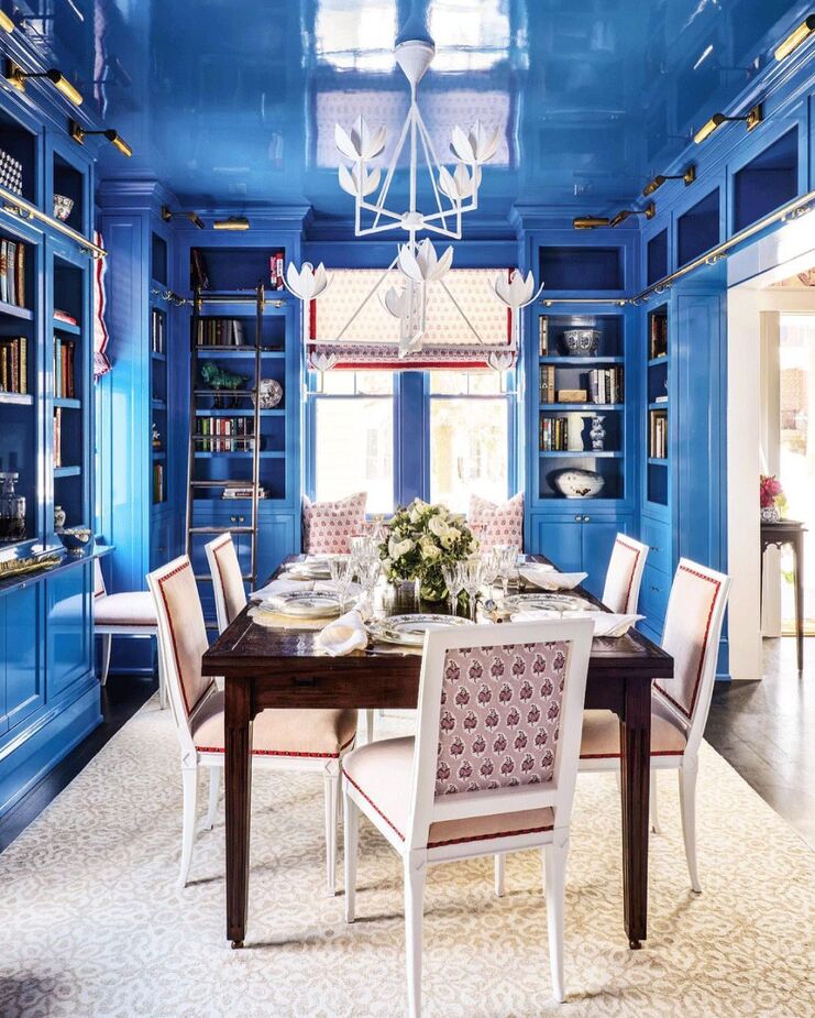 Rather than a library that doubles as a dining room, this is a dining room that pinch-hits as a library. Designed by Cameron Ruppert Interiors, the room includes a cozy window seat tucked between two of the bookcases for curling up with one of the many tomes on the shelves. Find the chandelier here. Photo by Angie Seckenger.
