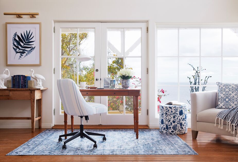 Flora and fauna, along with a rainbow of blue hues, get this home office ready for spring. Find the desk here, the chair here, and the rug here.
