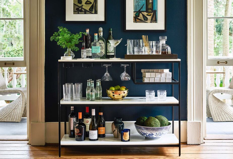 An empty bowl, no matter how lovely, is still an empty bowl. The addition of oversize Moss Balls, however, transforms it into an objet. Find the bar console here.
