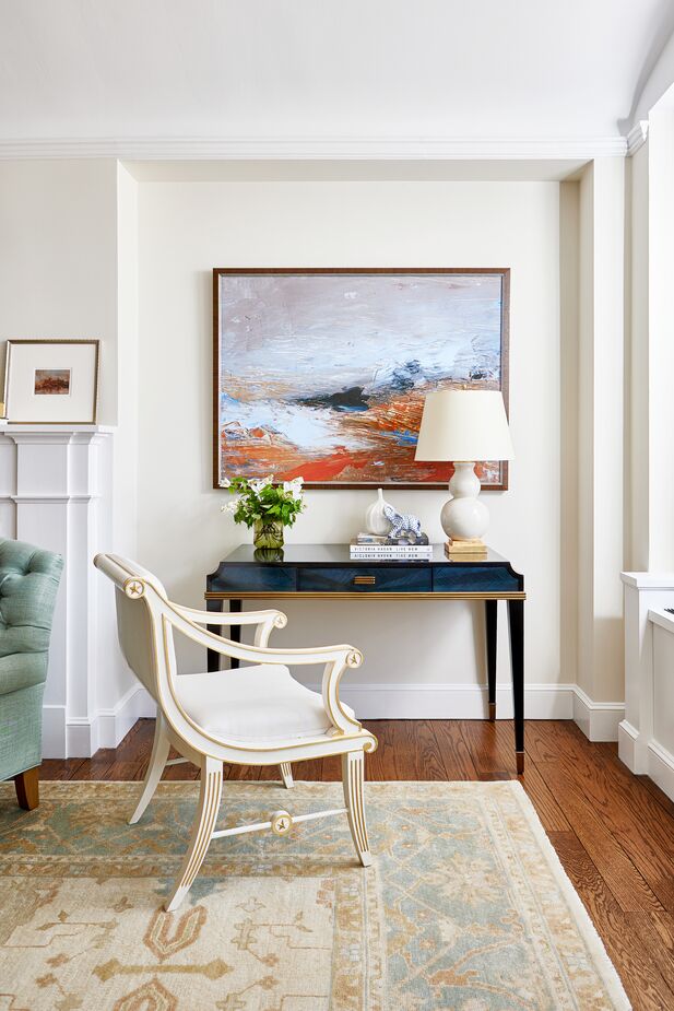 The Kallista Writing Desk and the Star Accent Chair reference different periods and provenances. “Balancing and mixing different styles helps a room feel fresh and keeps it from being a pastiche of traditional,” Jordan says. Find the table lamp here. 
