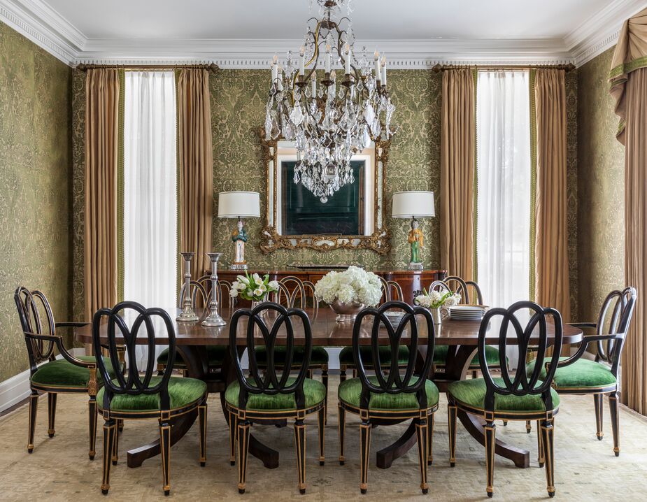 The dining room is probably Chandos’s favorite space in the home: “It has a wonderful mix of antiques, and it just seems the perfect spot for any holiday with the green-and-gold damask walls. I love an ebony chair with a classic Sheraton table too.” 
