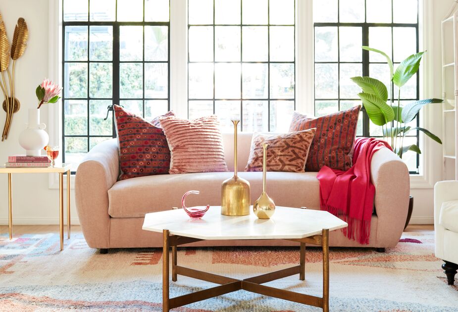 The cashmere throw’s pop of color raises the energy level of this living room without disturbing the luxe ambience. Find the sofa here and the cocktail table here. Photo by Joe Schmelzer.
