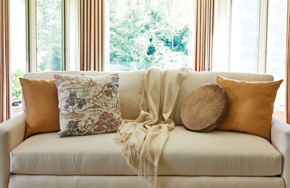 The Claire Disc Pillow in Toffee Velvet adds an element of the unexpected. Also shown: Hazel Pillows in Hemp Linen and Tucker Pillow. Photo by Frank Francis.
