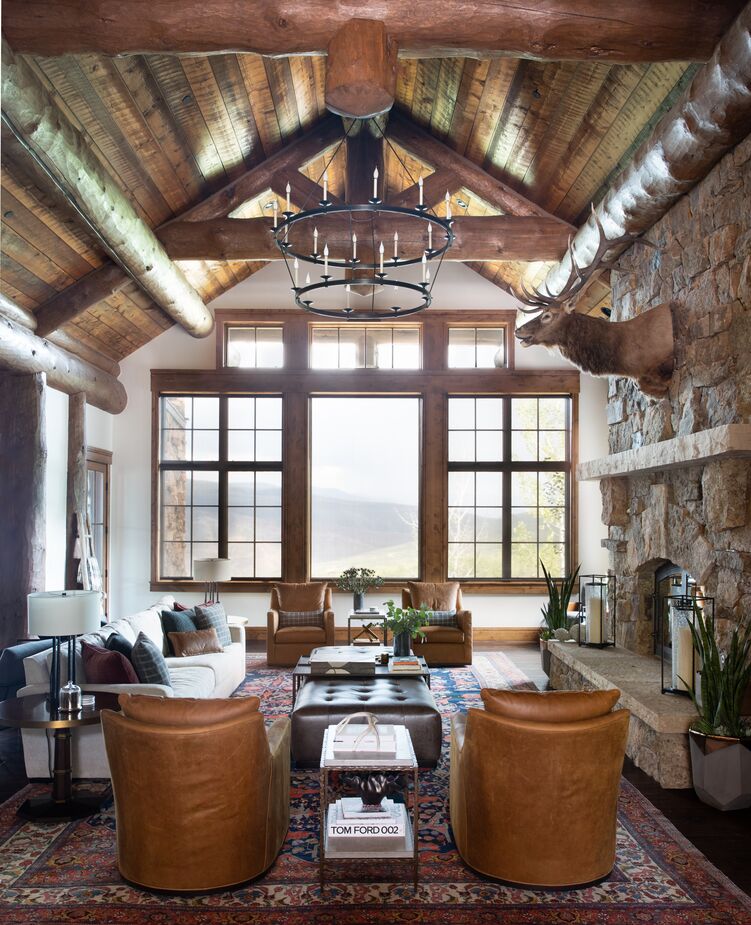This living area in a sprawling Vail, CO, lodge offers an earthier sort of luxuriousness. Designer Meredith Owen used elevated organic materials such as supple leather and lush wool to make the expansive space more intimate without distracting from the spectacular views. See more of the home here. Photo by Molly Culver.
