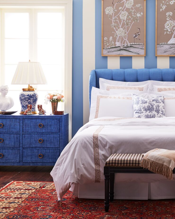 Above: Kos 6-Drawer Raffia Dresser in Indigo; Greek Key Duvet Cover and Shams in White/Tan. 
