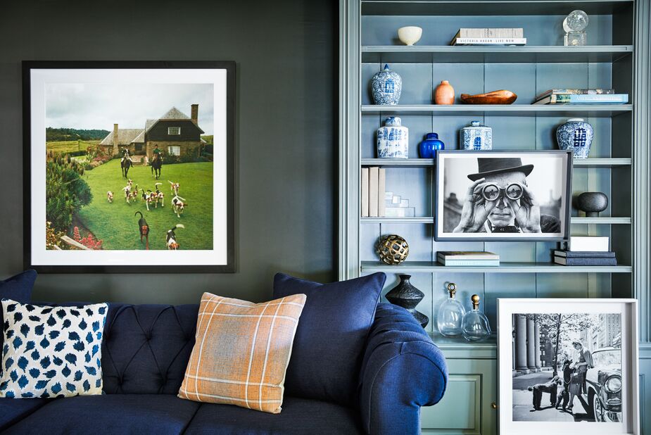 Adding pillows in unexpected styles (such as the Trinka and the Avery above) is one of the easiest ways to expand your style horizons. The same goes for art; shown above from left: Masons in Kenya, Derby Spectator, and Inga Lindgren and Poodles. Find the sofa here. Photo by Joe Schmelzer. 
