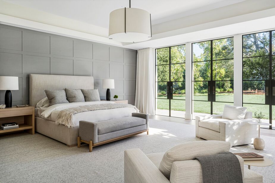 Even without the view of the verdant grounds, this bedroom designed by Heather Hilliard would be a blissful space to wake up in. The soothing neutral palette, the layers of luxe texture, the rhythmic molding that echoes the square panes of the glass doors… ahhh. See the rest of the home here. Photo by David Duncan Livingston.

