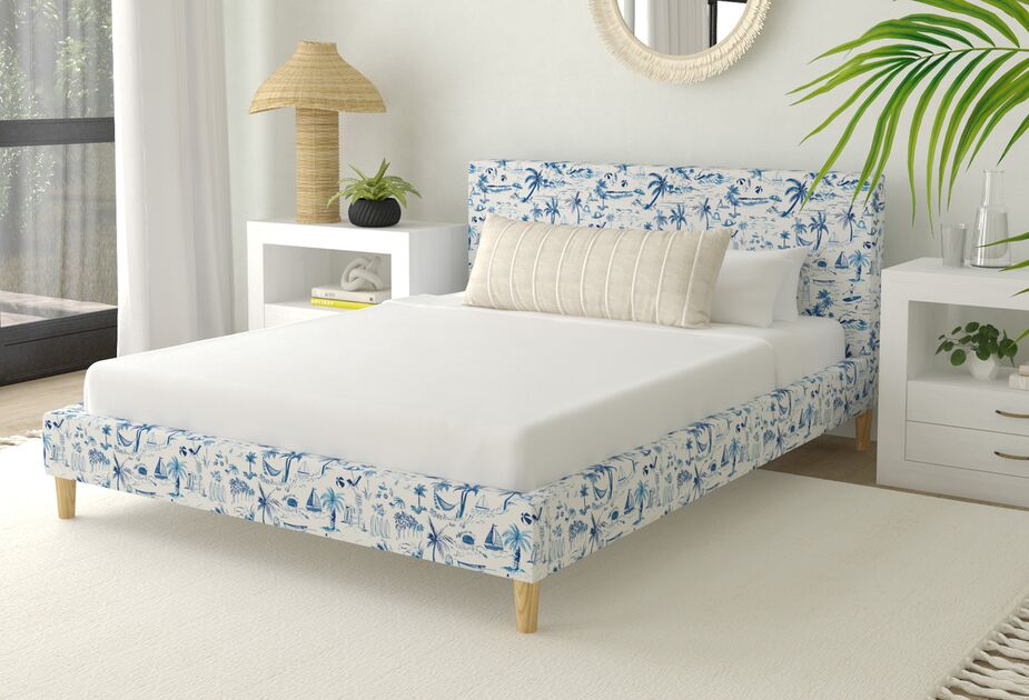The Lili Beach Toile Bed in Navy depicts hammocks, surfers, and sailboats with Old World elegance. Find a similar rug here. 
