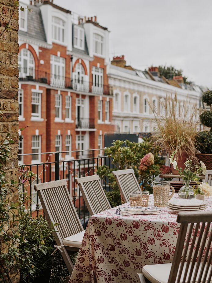 A pair of French doors in the office lead to the terrace, the site of many a dinner party as well as numerous plants.
