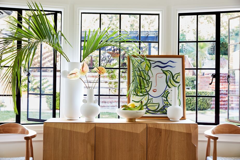 Fiddle Fig & Girl by Rob Delamater suggests tropical ease in a quietly sophisticated way. Find the sideboard here and the bowl here. Photo by Joe Schmelzer.
