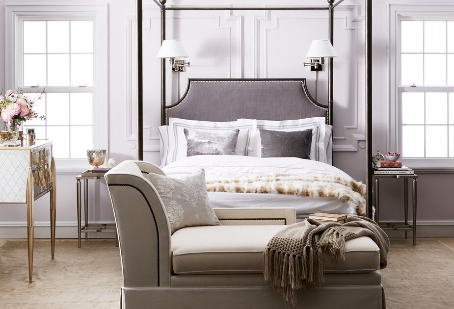 Why take up precious nightstand space with a lamp when you can opt for a sconce instead? For optimal versatility, consider a swing-arm sconce, such as the appropriately named Classic Swing-Arm Sconce above. Find the chaise here.

