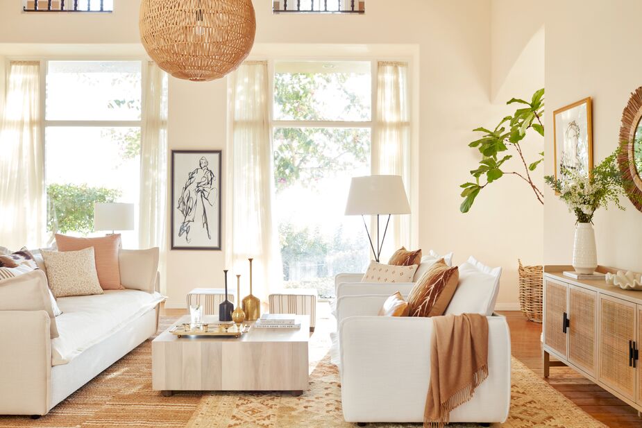The inviting richness of this neutral-tone Naturalist room comes from the layers of organic textures. Find the sofa here and the armchairs here; find the pendant here and the coffee table here. Photo by Joe Schmelzer.
