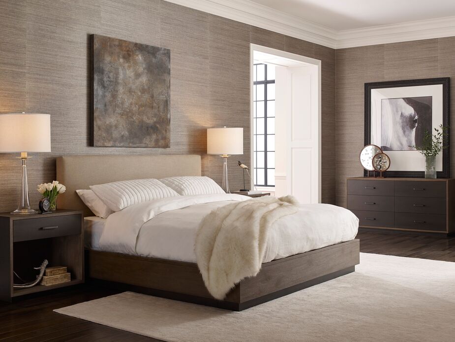 The monochromatic palette, from the Baldwin Bed and Nightstands to the grass-cloth wallpaper, adds to this bedroom’s hotel-style luxuriousness, as does the Milo Faux-Fur Throw.
 
