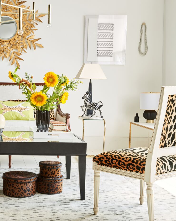 The classic silhouette and carved detailing of the Exeter Side Chair ensure that the leopard print feels refined rather than brash. At the same time, the lumbar pillow with its watercolor leopard manages to be both chic and whimsical.

