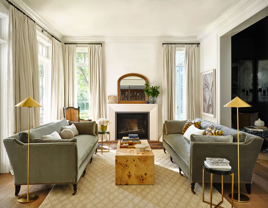 The relatively low profile of the Margot Velvet Sofa—it’s only 34 inches high—makes it well suited for floating in a room. Also shown: the Orsay Floor Lamp, the Chloe Coffee Table, and the Mason Mantel Mirror. Photo by Read McKendree.
 
