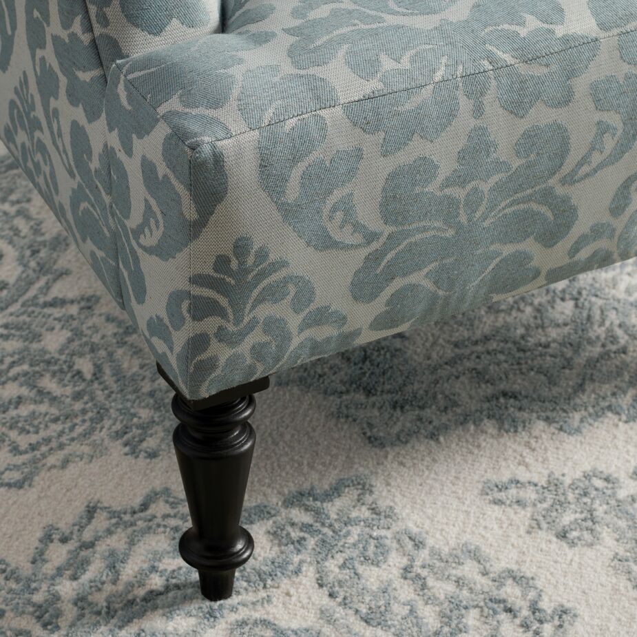 The hand-turned legs of the Grady Chair (shown here in Skylands Damask in Rainwater) are just one of the classic elements that set this collection apart. 
 
Shown at top: the Peyton Sofa in Lily Pond Linen Weave in Georgica.
