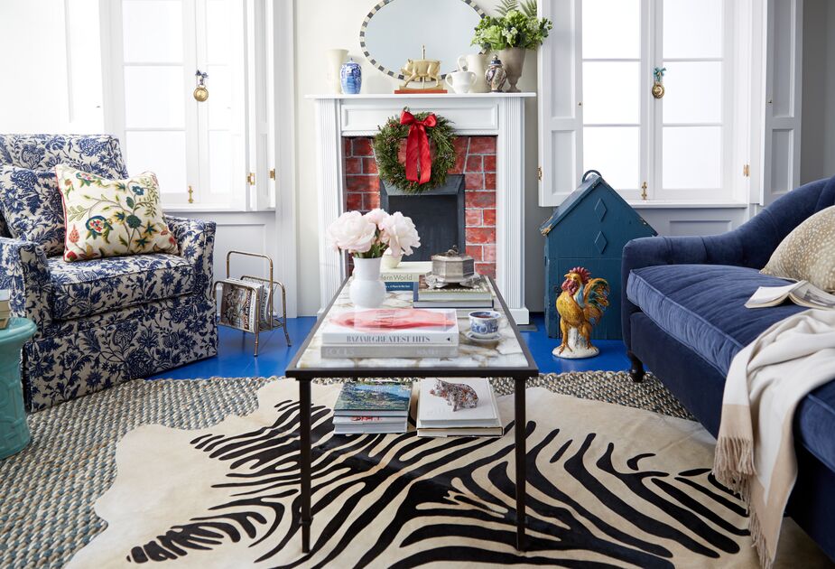 More proof of how well animal prints can play with other patterns. The relatively tight palette—blues and neutrals—helps, as does the fact that as the largest-scale print, the zebra rug is also the simplest.
