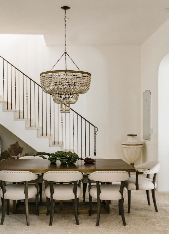 Layers of texture maintain the dining room’s serene, neutral-tone vibe while adding sophistication.
