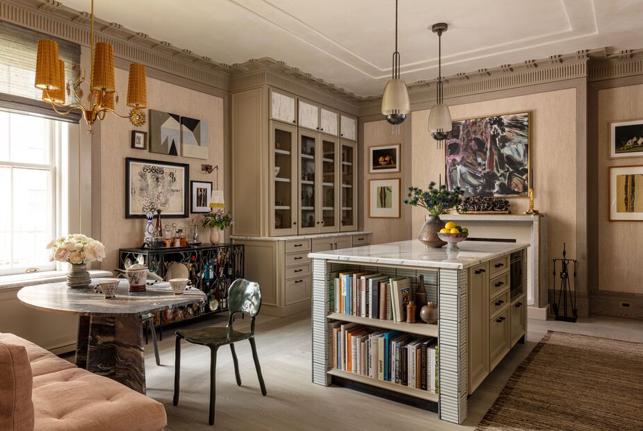 “I wanted the space to feel like an updated version of the kitchen that may have been original to the house,” says Wesley Moon of his show house room. To achieve that goal, he added custom crown molding by Hyde Park Mouldings and had LaPolla Designs give the cabinetry a hand-applied finish. Contemporary artwork and the sculptural table and chair ensure that the space doesn’t feel stuck in the Edwardian era.
