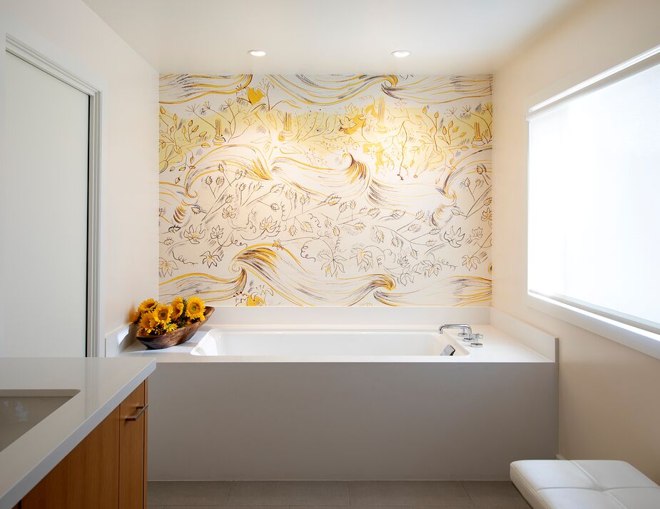 “The yellow bathroom mural is a wallpaper by UK brand Surface View,” Karen says. “The mural was sourced by the client and was the starting point of the bathroom remodel’s finished palette.”
