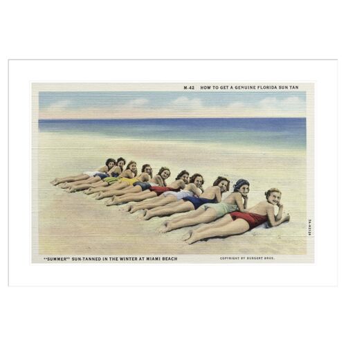 Women Sunbathing on a Beach by Burgert Brothers Framed Print