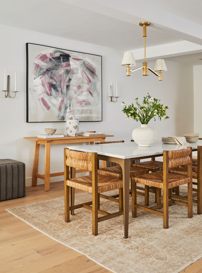 Having two floors was important to Maggie, so that she could entertain downstairs without waking her sons upstairs. Find a similar dining table here.
