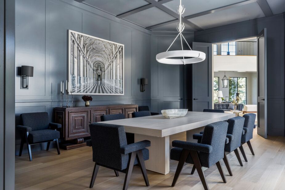 The dining room is one of Heather’s favorite rooms in the home (the library, which has a similar palette, is the other). The French Art Deco buffet and the oversize photo of Italy’s Palace of Venaria add Old World elegance to the contemporary furnishings.
